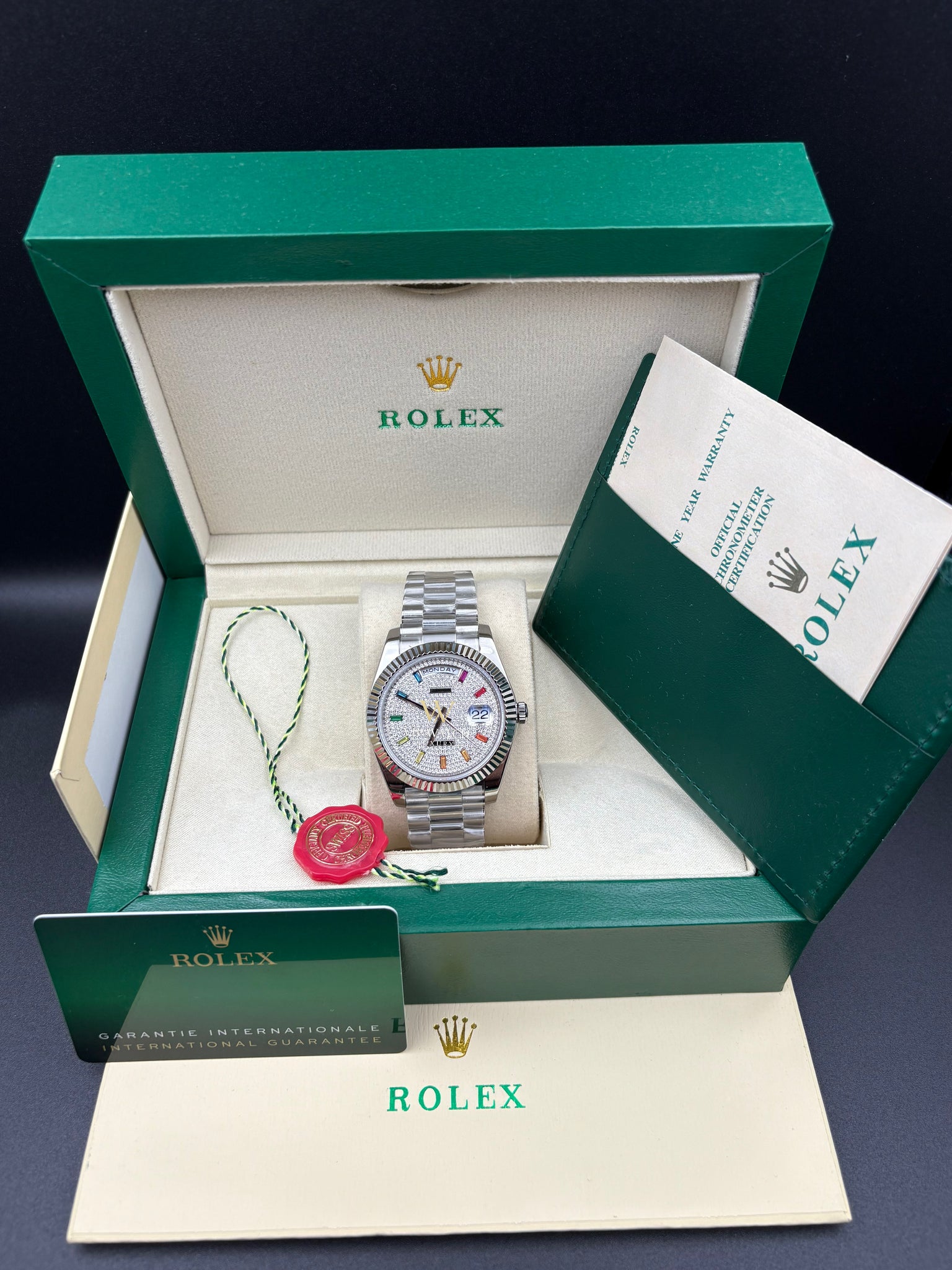 DAY DATE 40MM WATCH FLUTED BEZEL DIAMOND PAVED RAINBOW SAPPHIRE DIAL